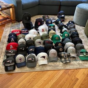 107 Boston sports baseball caps: 45 Red Sox, 3 Bruins, 33 patriots, 26 Celtics